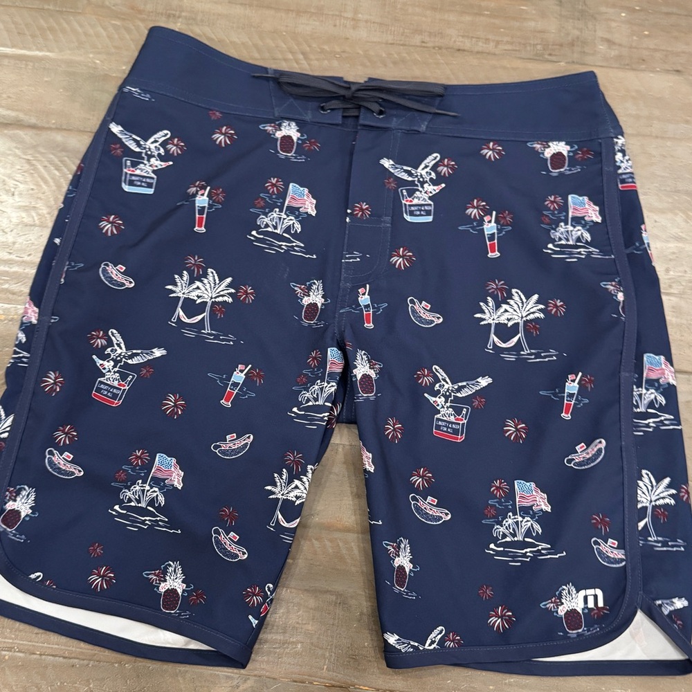 Travis Mathew Navy Board Shorts with Tropical Print